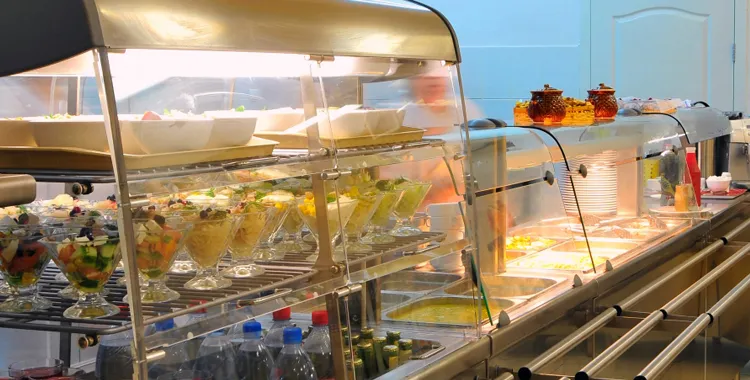 Healthy canteen food in display cabinet.