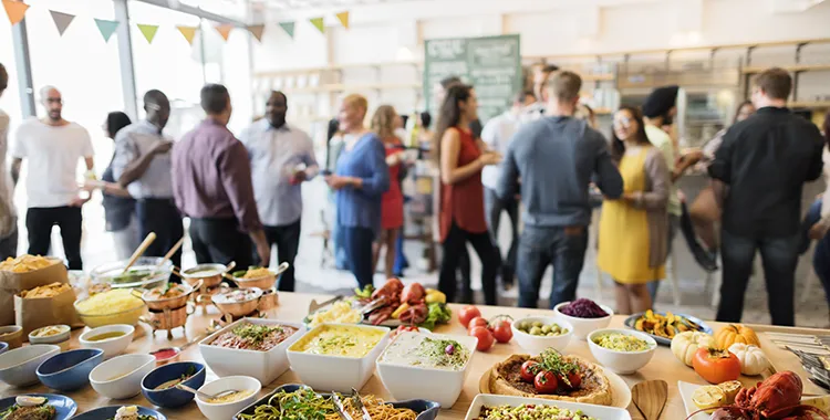People near food at a buffet