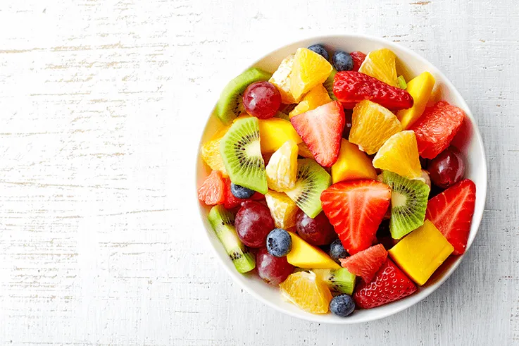 Fresh fruit salad in a white bowl