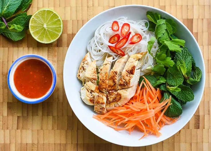 A bowl of rice, noodles and other ingredients
