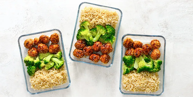 Tupperware containing meals ready to be frozen