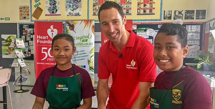 Dave in classroom with two students