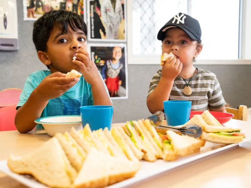 2 toddlers having a healthy meal