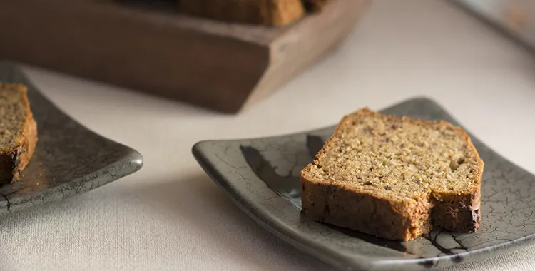 Classic banana bread loaf—moist, tender, and packed with mashed banana—served sliced on a plate and ideal for breakfast or snacking.
