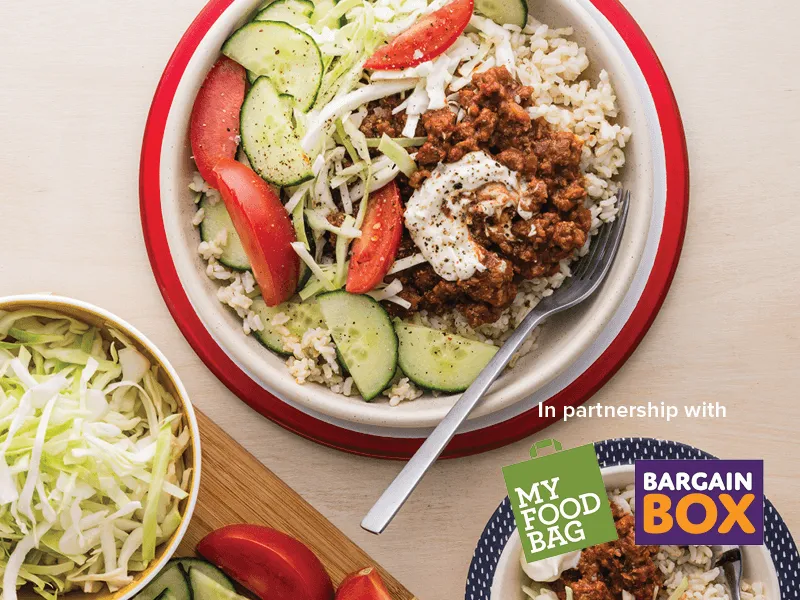 Bowls of Greek beef with brown rice and yoghurt