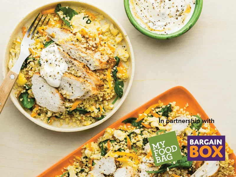 Serving of lemony chicken bulgar wheat and yoghurt in a side bowl