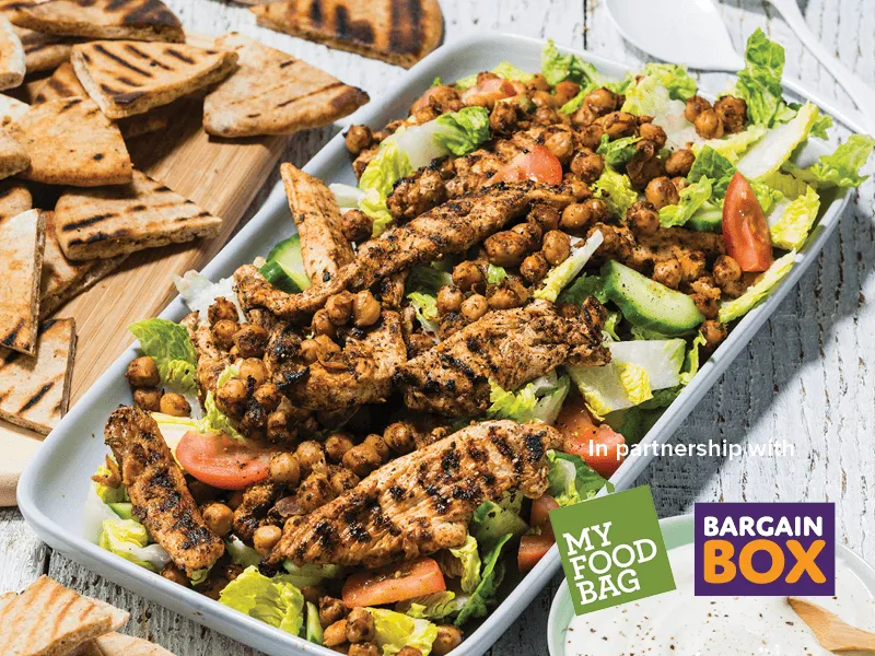 Platter of BBQ chicken salad and pita chips