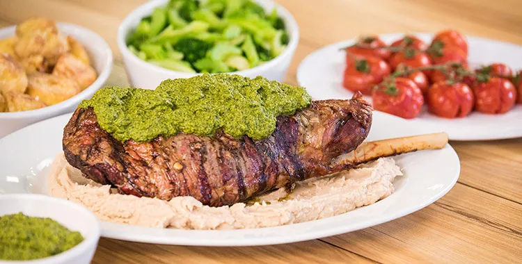 bbq leg of lamb with healthy green sauce and butter bean puree