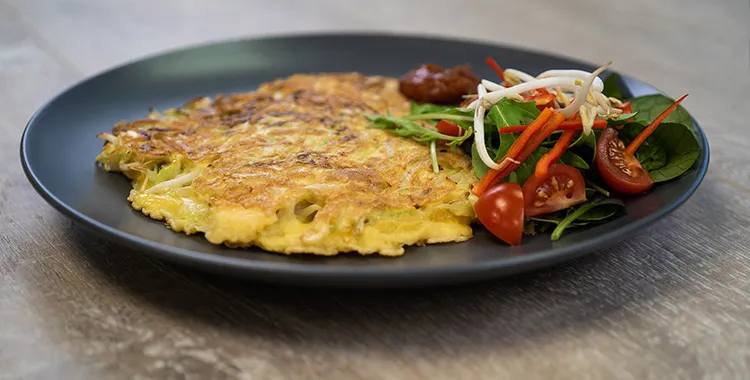 vegetable fritters with salad and relish