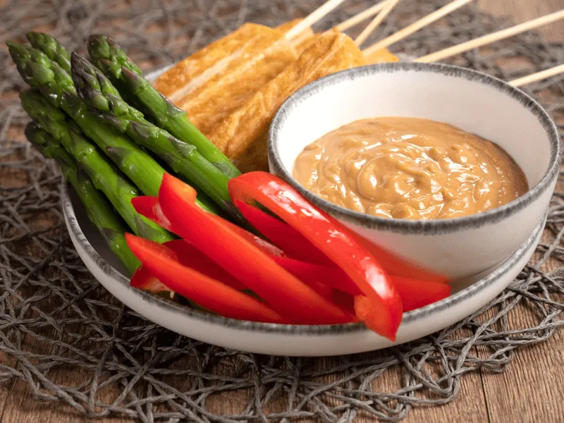 Easy satay sauce—rich, creamy peanut butter dip made with coconut milk or cream, soy sauce, lime, and a touch of chili, perfect for dipping veggies, tofu skewers, and more.