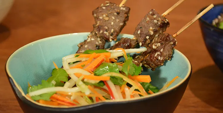 Vibrant and fresh salad with skewered venison