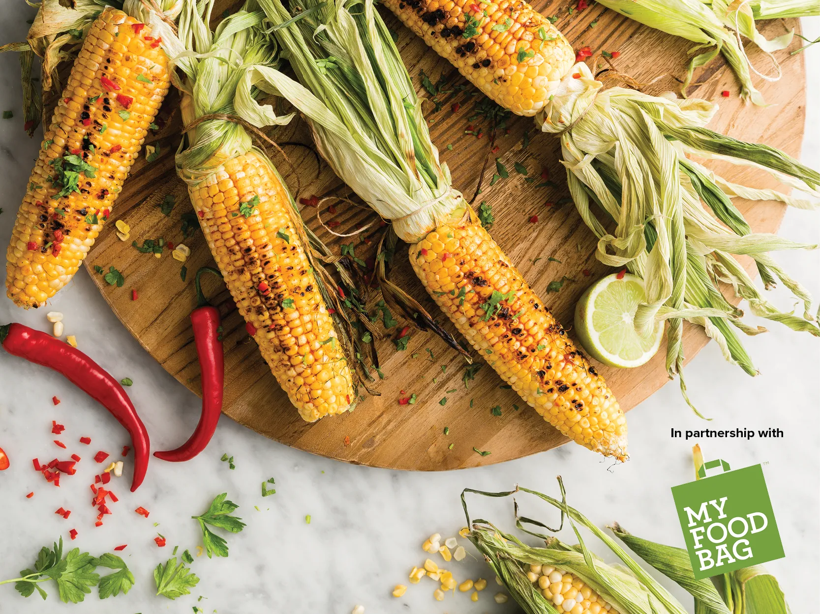 Whole corn on the cob grilled on the bbq