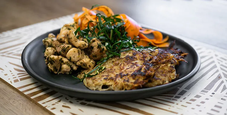 Pan fried chicken, carrot salad and potato rosti
