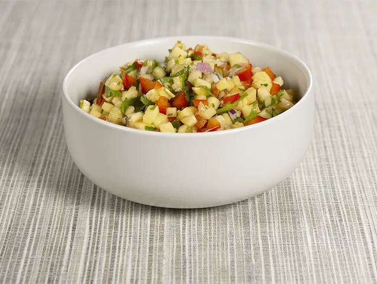 Fresh pineapple salsa in a white bowl