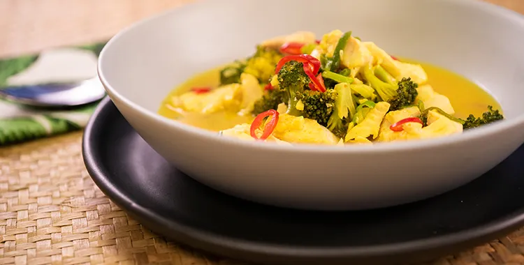 fish and broccoli poached in a light curry sauce