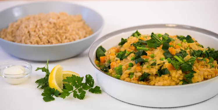 Red lentil and vegetable curry served with rice