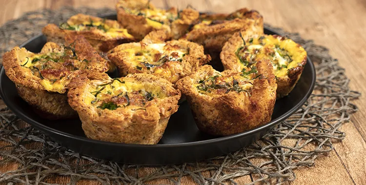 A plate of freshly basked spinach and cheese bread cases. Looking golden and delicious.