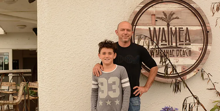 Chef and son outside family restaurant