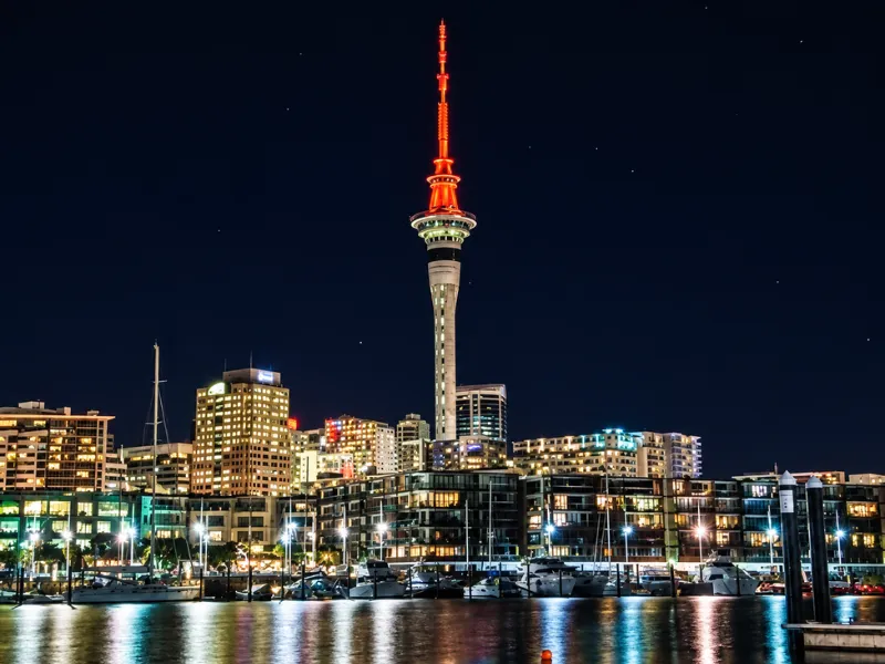 Auckland Sky Tower lit red above the waterfront for World Heart Day, raising awareness of heart disease in New Zealand.