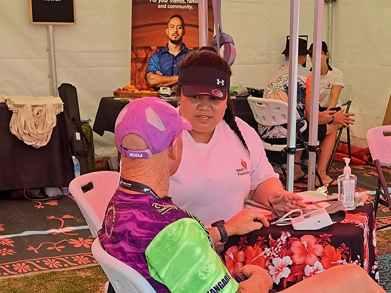 Heart Foundation staff member speaking to member of the public.