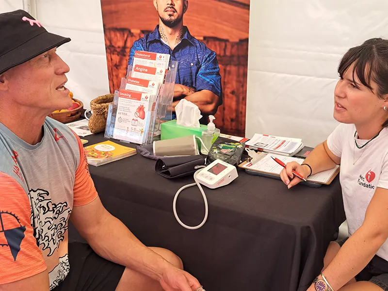 Heart Foundation staff member speaking to member of the public.