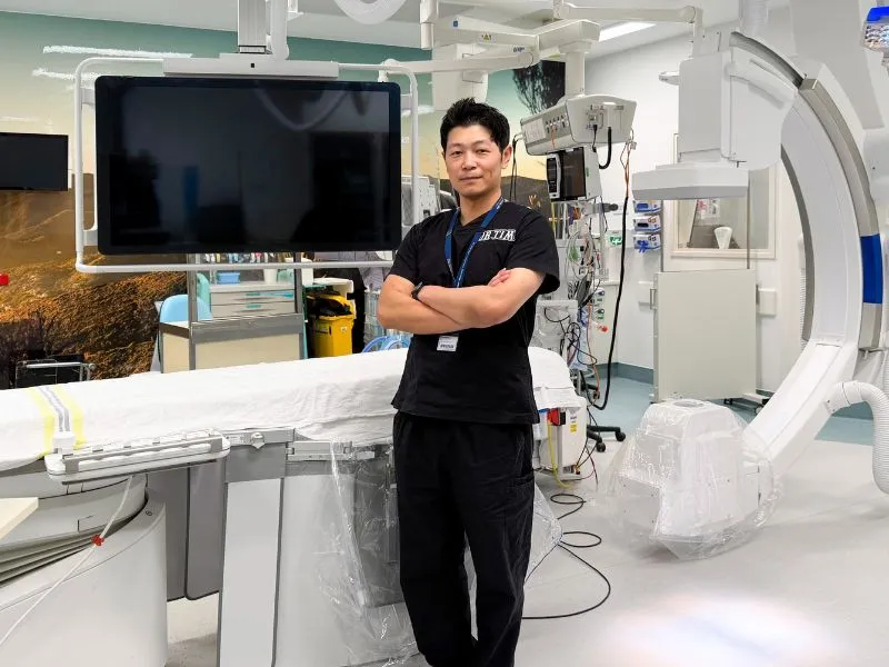 Dr Tim Oh in a cardiac catheterisation lab during overseas fellowship training in less invasive heart procedures