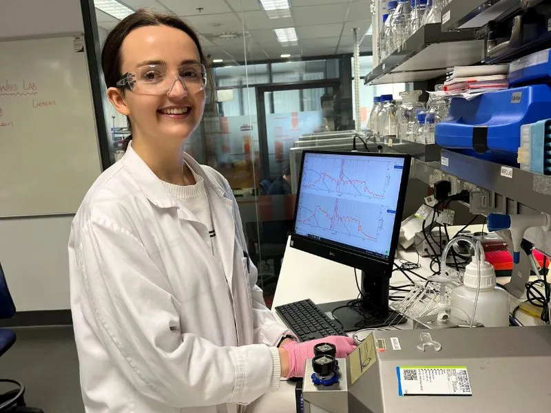 A medical professional in the laboratory along with medical equipment.