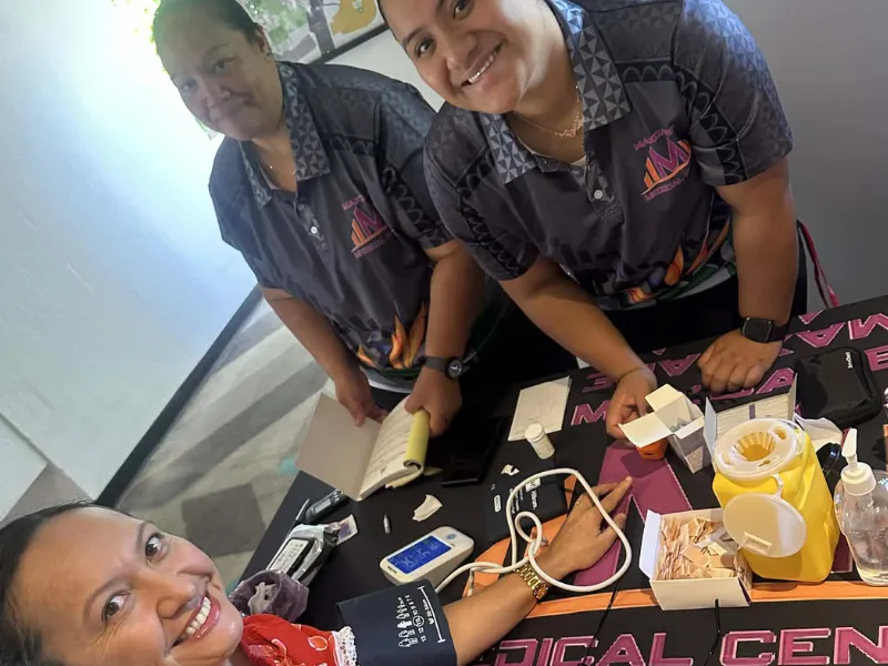 Maxcare medical staff providing free blood pressure checks at a Pacific Heartbeat and Heart Foundation Pasifika heart health screening event in New Zealand