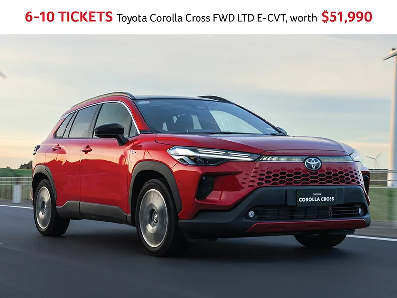 Red Toyota Corolla Cross FWD LTD E‑CVT SUV promotion offering 6–10 lottery tickets and prize worth $51,990