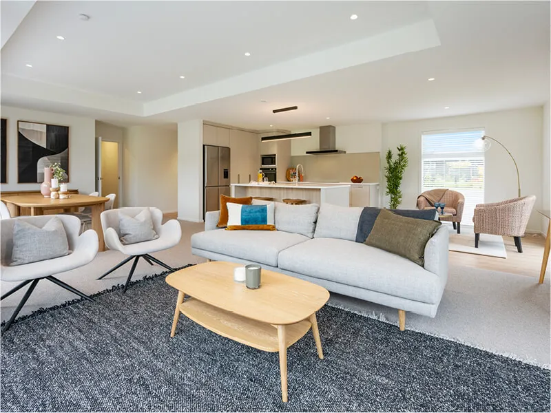 Bright and spacious lounge area with contemporary furniture and natural light from wide windows.