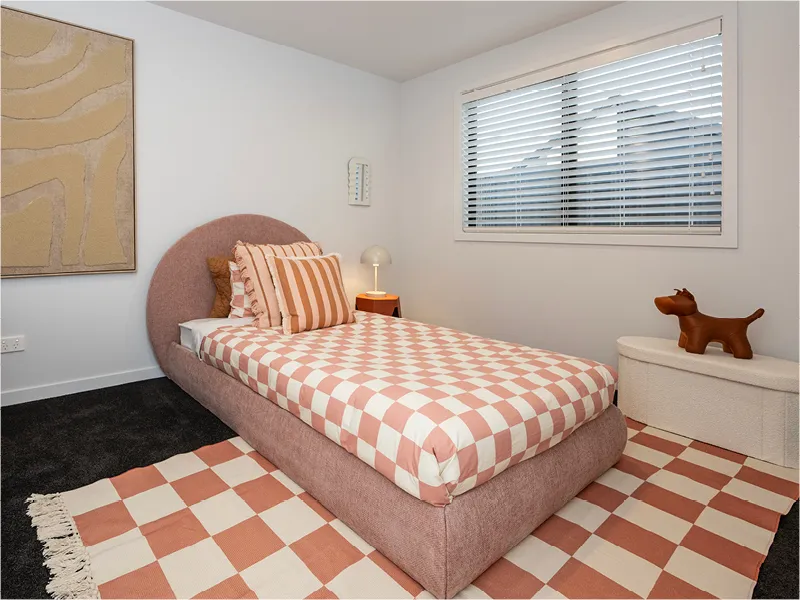 Family bathroom in the Napier lottery home with freestanding bathtub, large vanity, circular backlit mirror, and tiled feature wall.