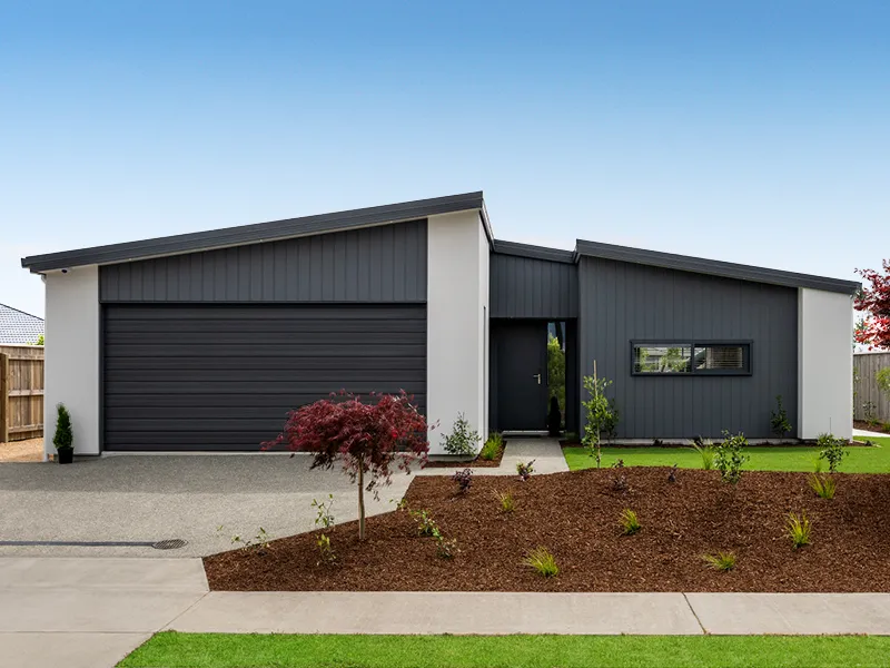 Modern three-bedroom Heart Foundation Lottery 162 home exterior in Richmond, Nelson with landscaped front garden and double garage