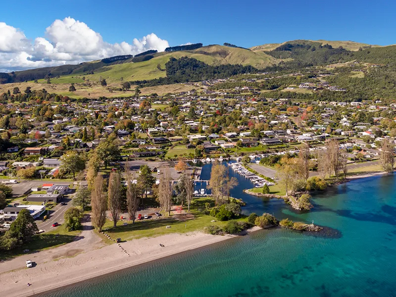 Aerial view of Kinloch lakeside marina, beach and village at Lake Taupo.