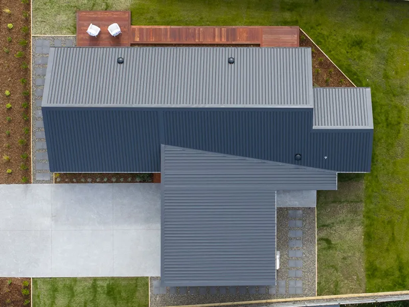 Overhead view of Kinloch home roofline, driveway and timber decking with outdoor seating.