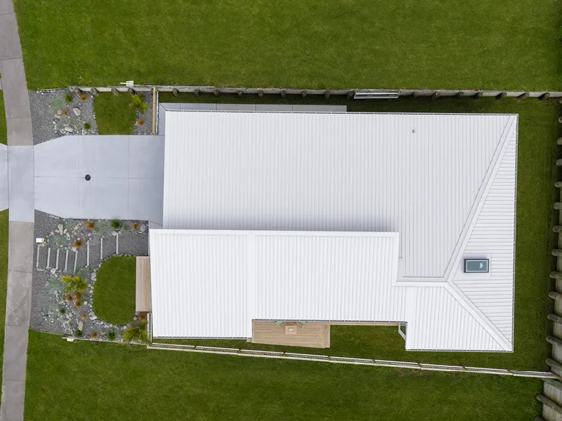 Aerial rooftop view of the brand-new Jennian show home with landscaped garden and driveway, Heart Foundation Home Lottery No. 165 Ōmokoroa.