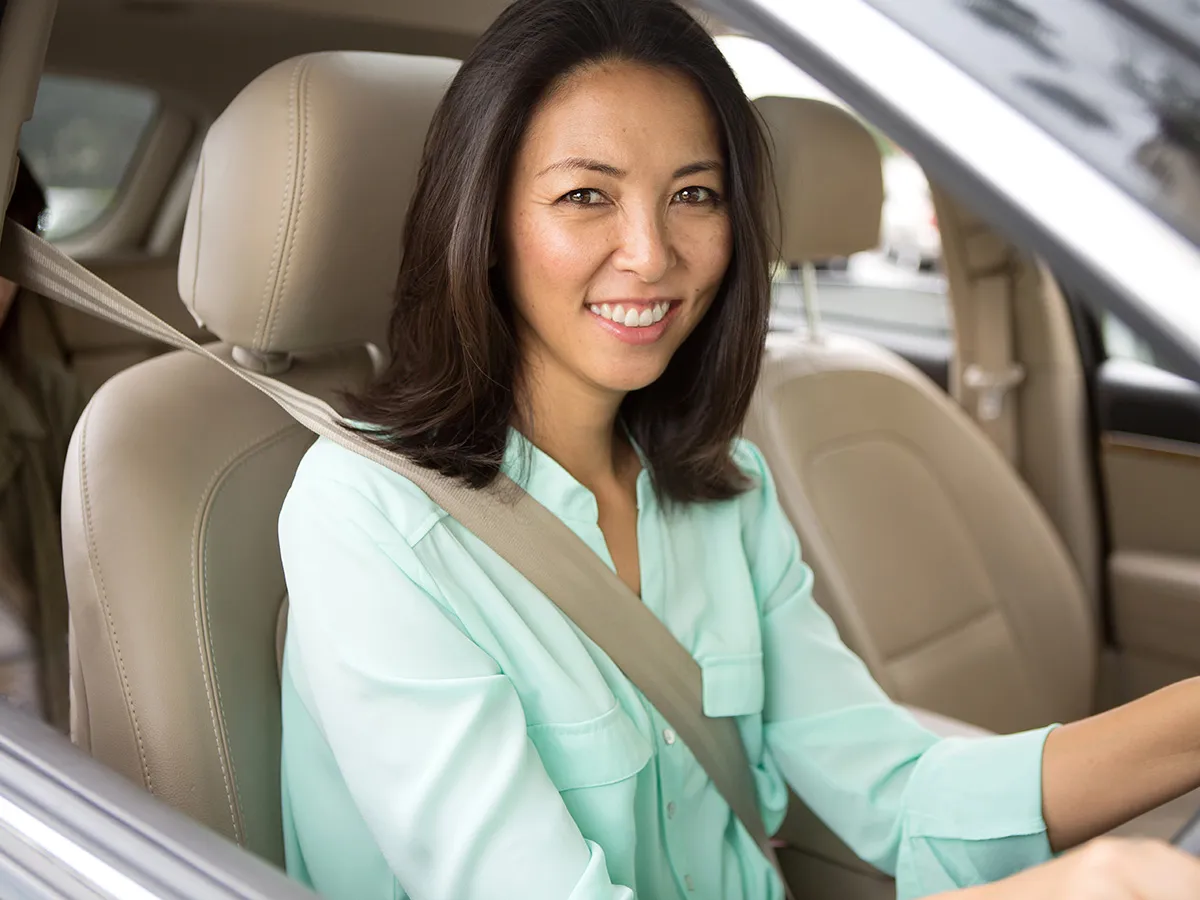 women driving car