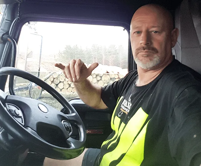 Dean Harding sitting inside the cab of his truck.