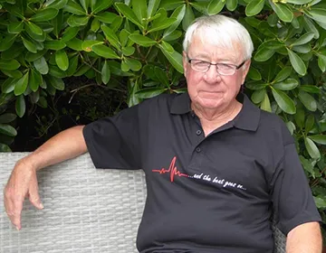 John Hollis sitting outside