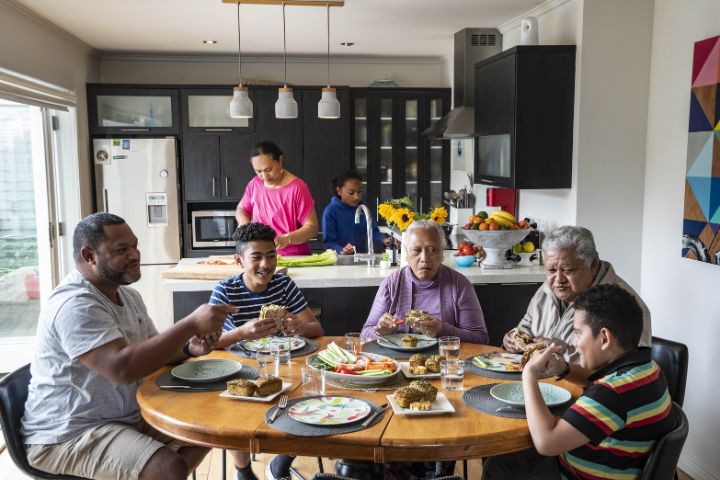 A joint family eating a healthy meal together 