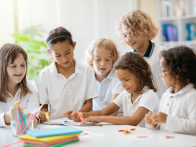 Children engaged in art project at school.