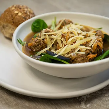 meatball soup with vegetables and wholegrain bun